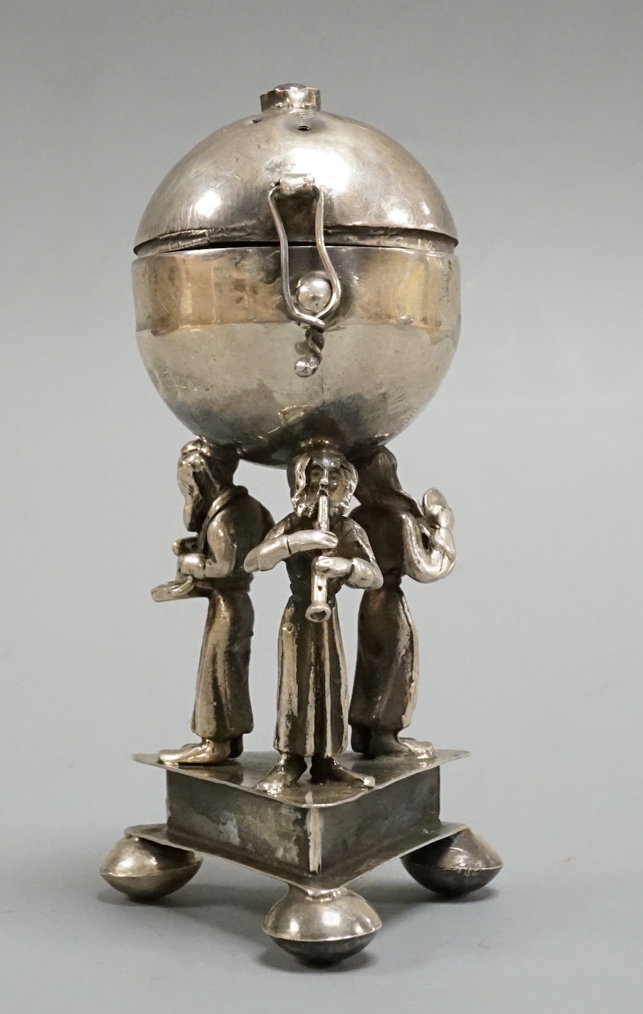 Judaica- A late 19th century Russian 84 zolotnik spice box, on tripod supports, dated 1873, height 88mm.